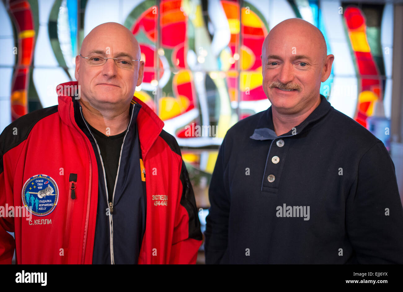 International Space Station Expedition 43 Commander NASA Astronaut Scott Kelly, left, stands with his identical twin brother former astronaut Mark Kelly at the Cosmonaut Hotel March 26, 2015 in Baikonur, Kazakhstan. Kelly and cosmonauts Mikhail Kornienko and Gennady Padalka launch in their Soyuz TMA-16M spacecraft on March 28 for a year long mission onboard the ISS. Stock Photo