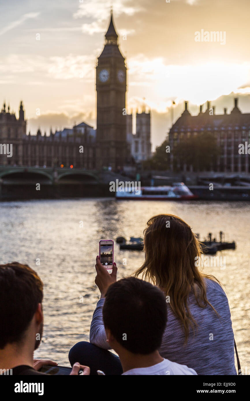 Girl Taking A Picture Of Big Ben EJJ9D0 