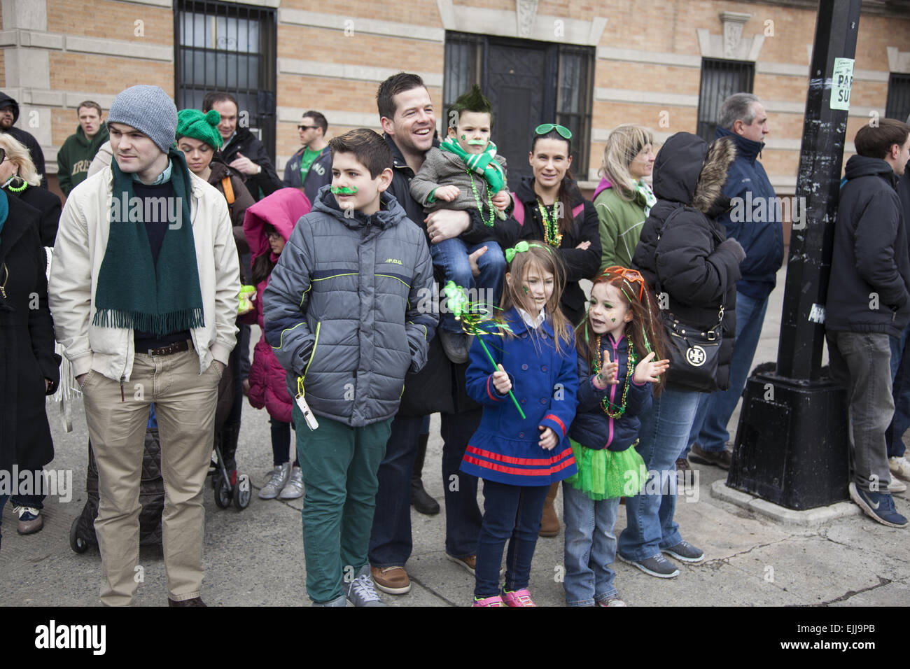Everybody's Irish on St. Patrick's Day. Spectators watch the parade in Park Slope, Brooklyn, NY. Stock Photo