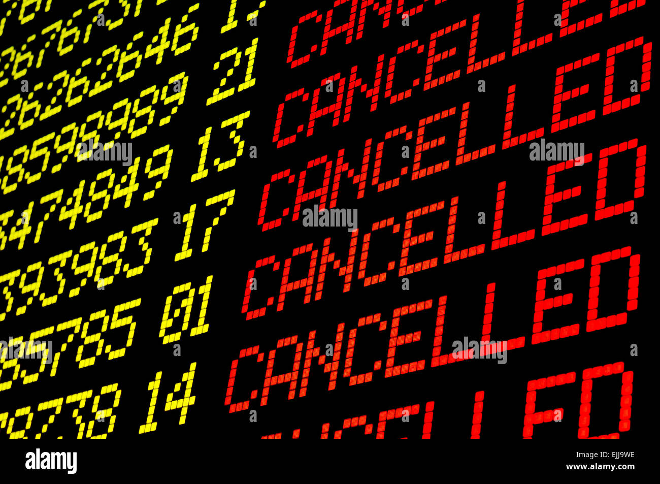 Cancelled flights on airport board panel Stock Photo