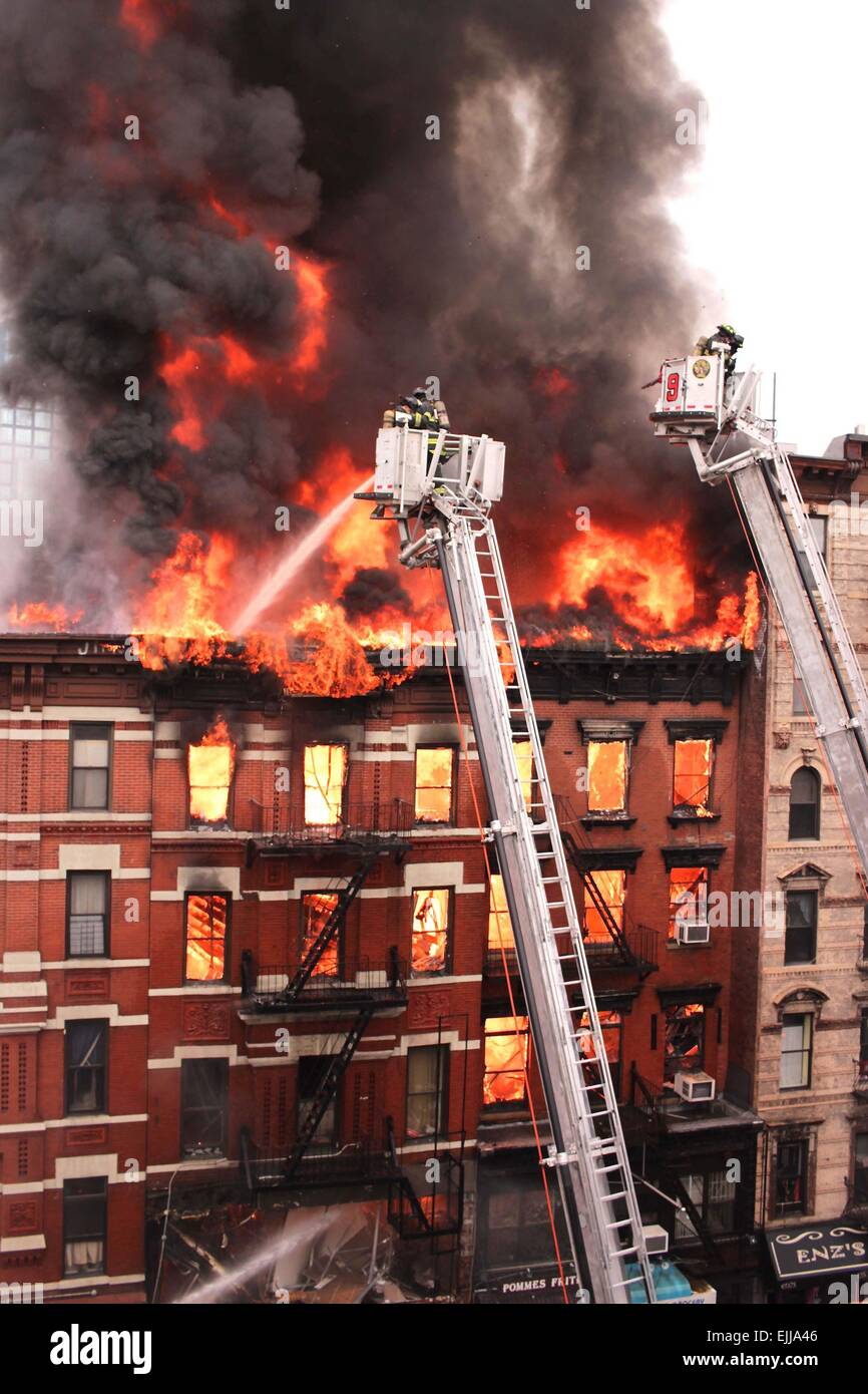 New York, New York, USA. 26th Mar, 2015. As many as 30 people were hurt when an explosion caused a partial building collapse and ignited a massive fire in the East Village on Thursday afternoon. Two people were unaccounted for after a building explosion led to a seven-alarm fire in New York City, according to city officials. © John Marshall Mantel/ZUMA Wire/Alamy Live News Stock Photo