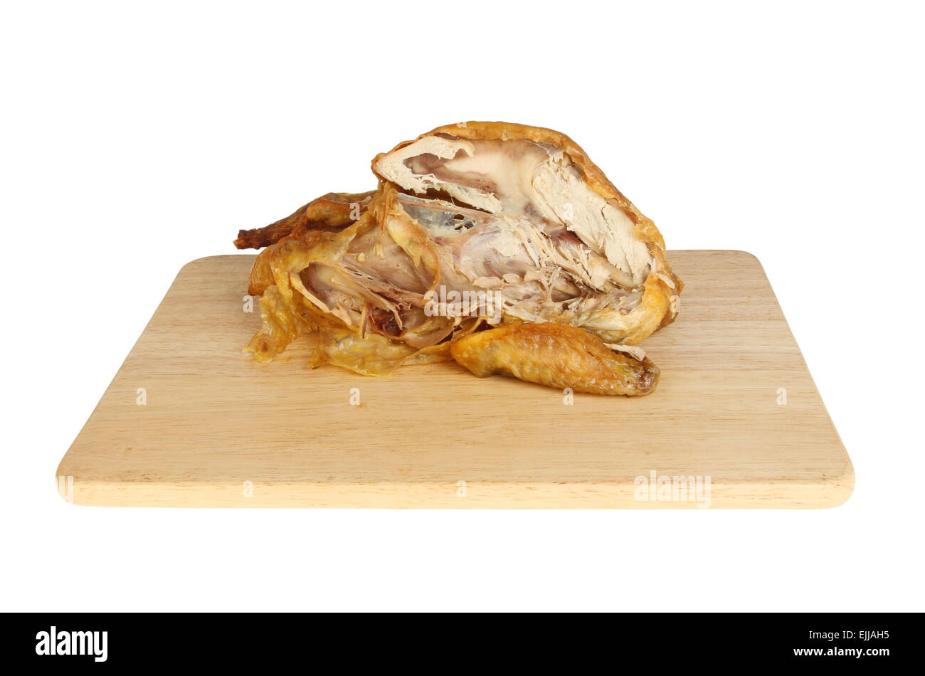Guinea fowl carcass on a wooden board isolated against white Stock Photo