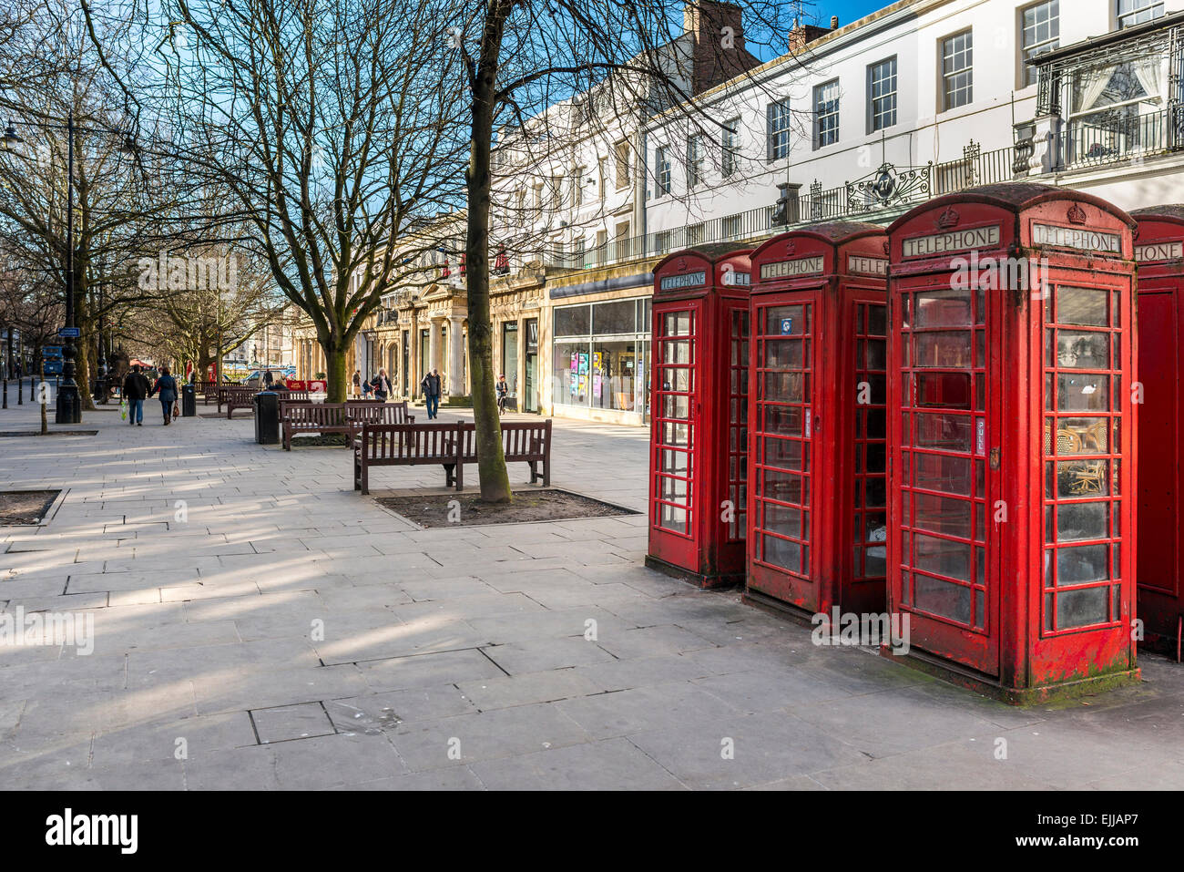 Traditional red telephone boxes on the Promenade in Cheltenham, Gloucestershire Stock Photo