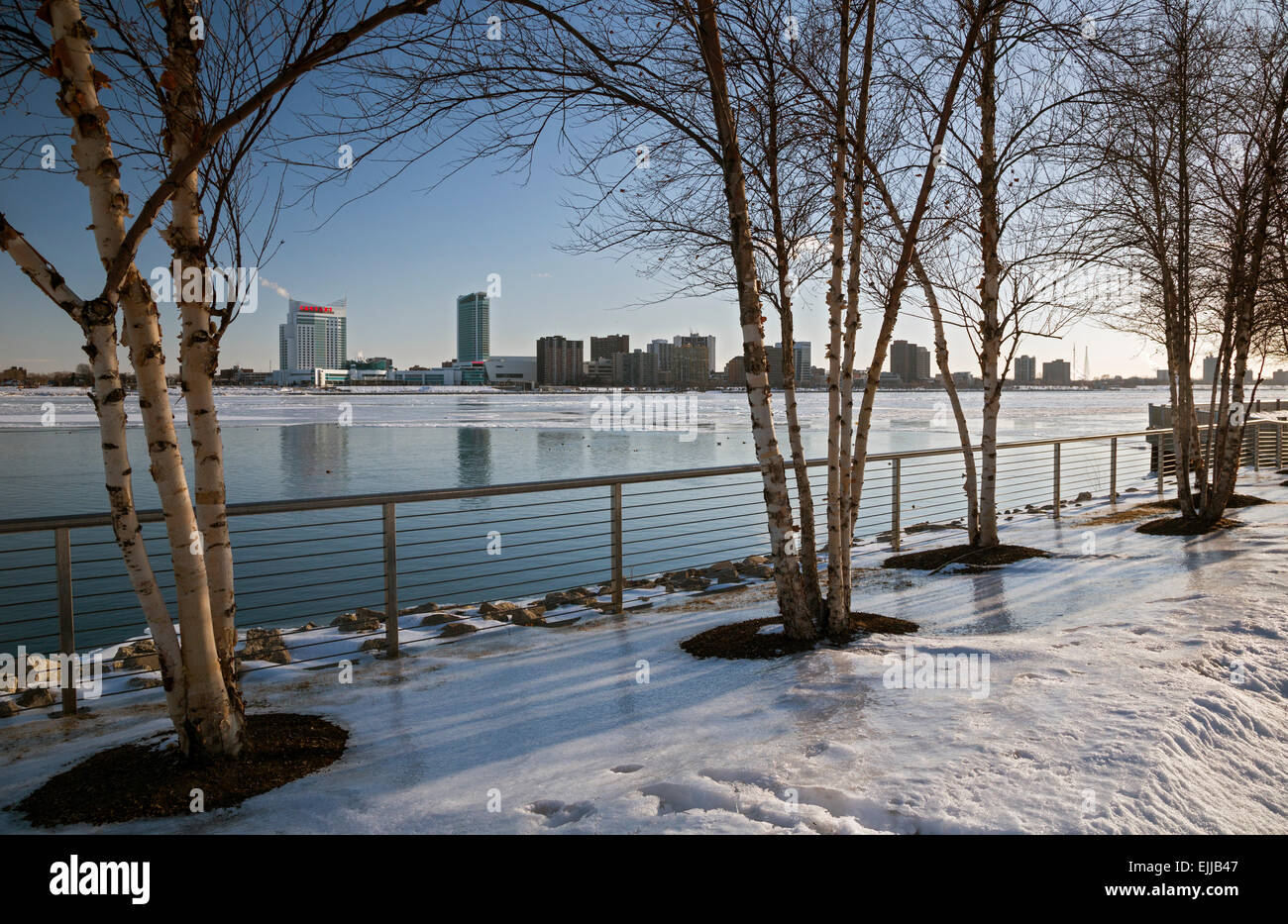 Detroit, Michigan - The Detroit River in winter, photographed from the Detroit Riverwalk. Windsor, Ontario is across the river. Stock Photo