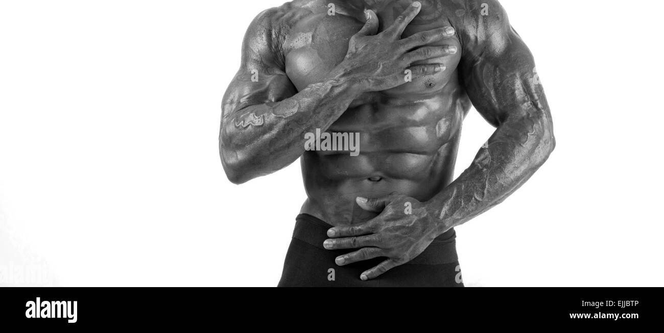 Close up on perfect abs. Strong bodybuilder with six pack. Keeping diet and training makes you ripped Stock Photo