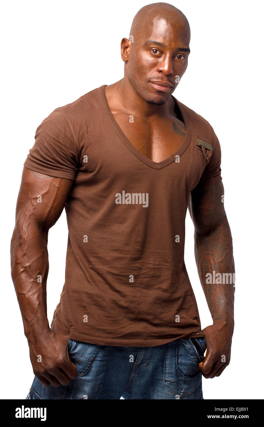Black bodybuilder in casual clothes. t-shirt and jeans, isolated on a white  background Stock Photo - Alamy