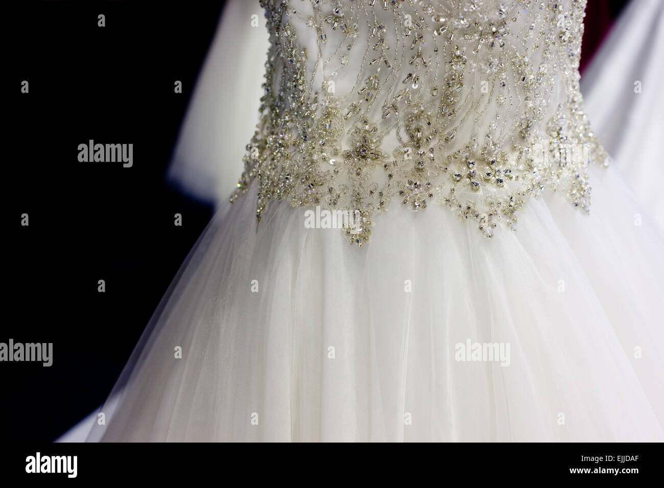 Detail of bridal gown with ornaments as pearls, silver and rhinestones Stock Photo