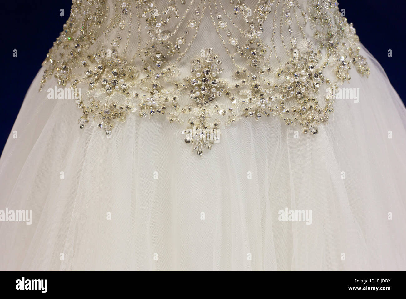 Detail of bridal gown with ornaments as pearls, silver and rhinestones Stock Photo