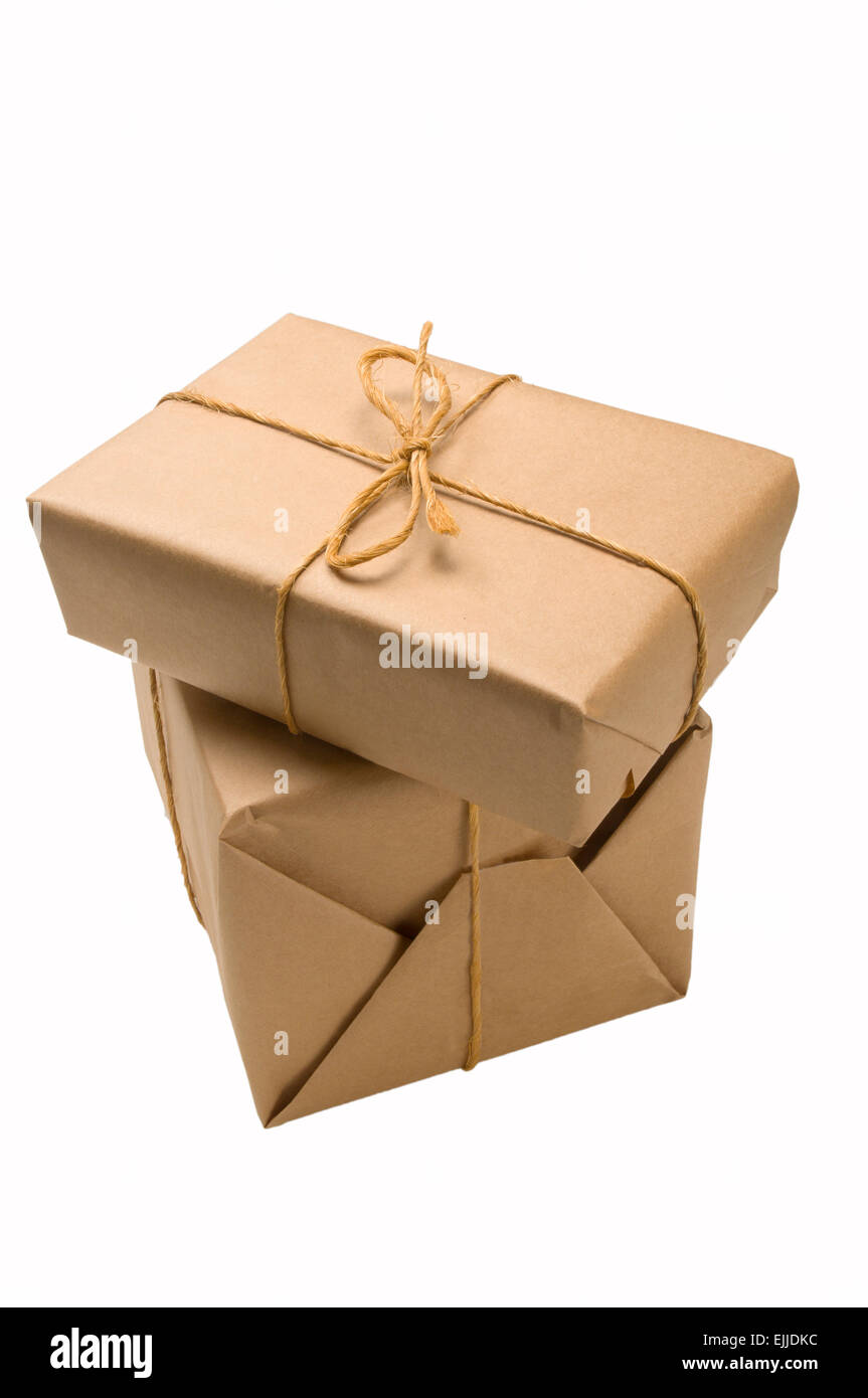 Stack of brown paper wrapped parcels for shipping Stock Photo - Alamy