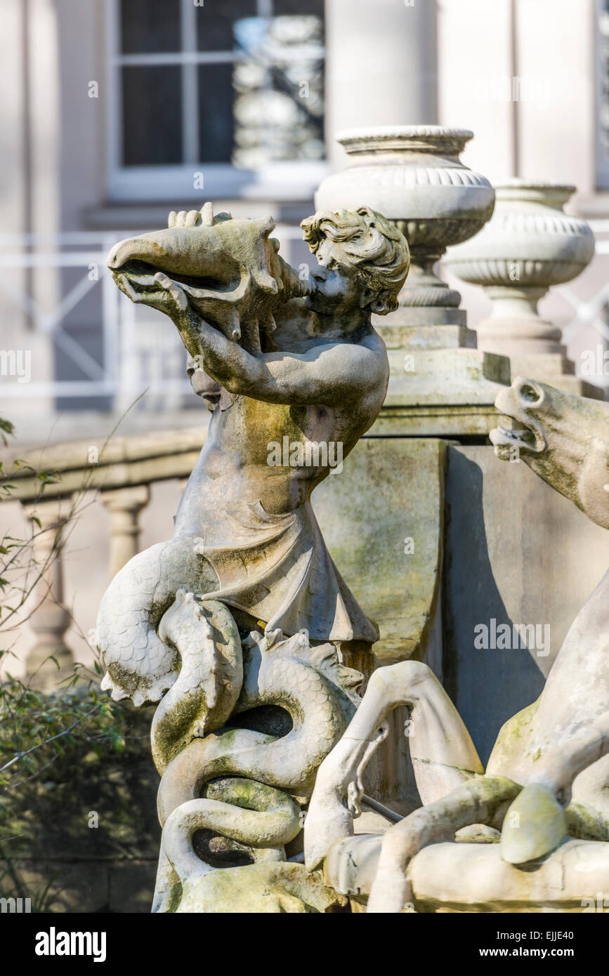 The Neptune Fountain in Cheltenham is a local landmark modeled on the Trevi Fountain in Rome showing sea god Neptune and horses Stock Photo