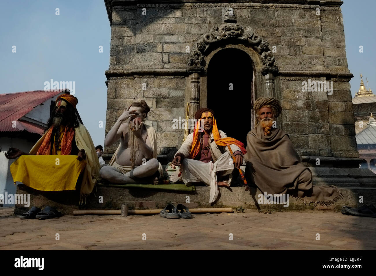 Aghori ascetic Shaiva sadhus with faces covered in ash and paint at Pashupatinath Temple which is on UNESCO World Heritage Sites list in Kathmandu Nepal Stock Photo