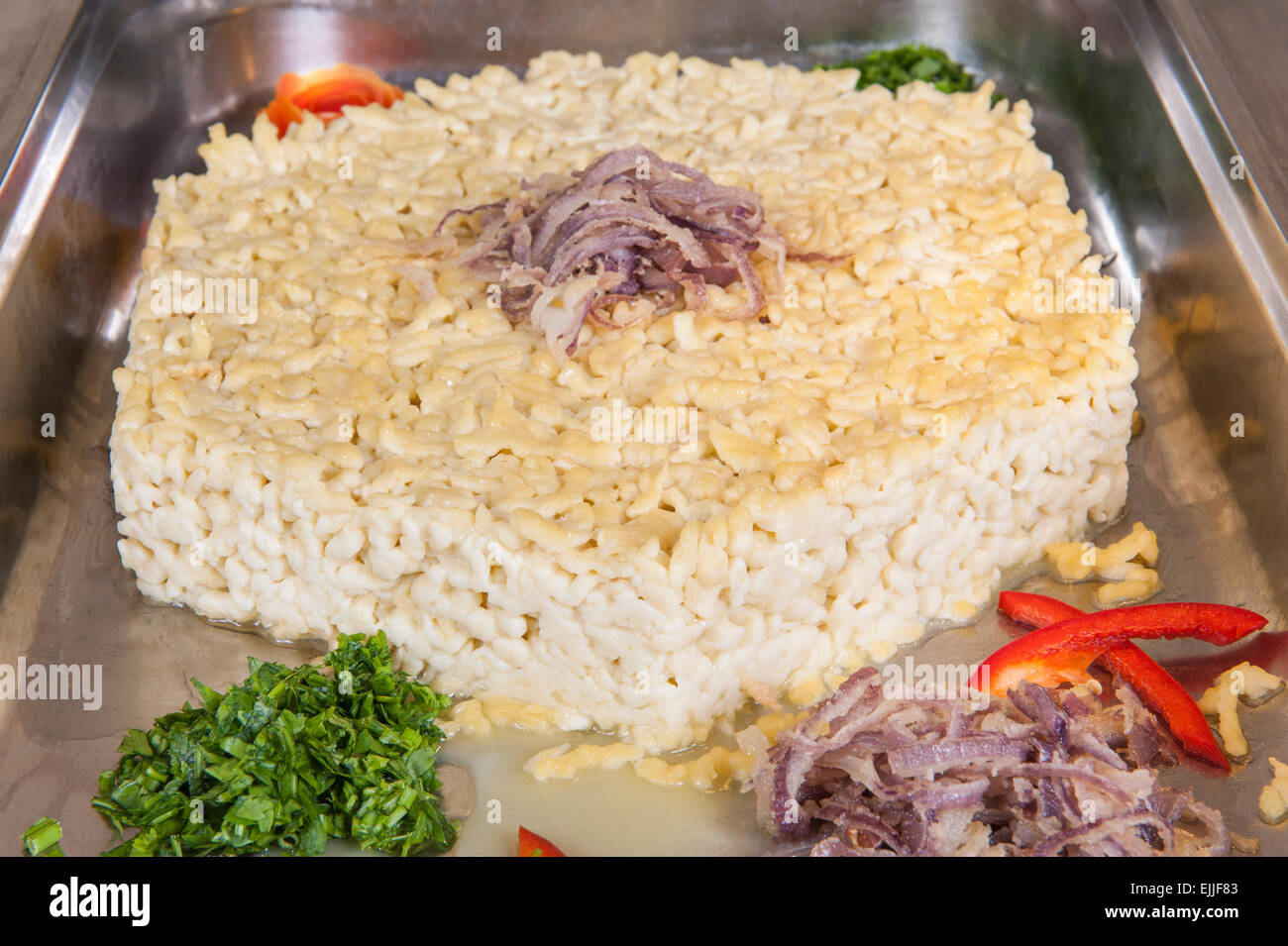 Closeup of German spaetzle noodle dumplings in tray at a hotel