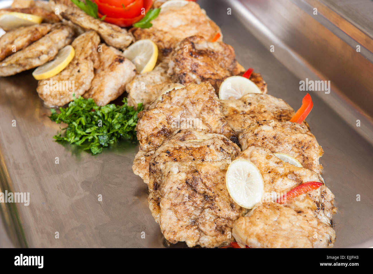 Fish Panne Grilled fish with egg panne on display at hotel restaurant buffet Stock ...