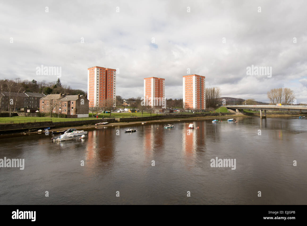 Newly refurbished and insulated high rise flats reflected in the River Leven, West Bridgend, Dumbarton, Scotland, UK Stock Photo