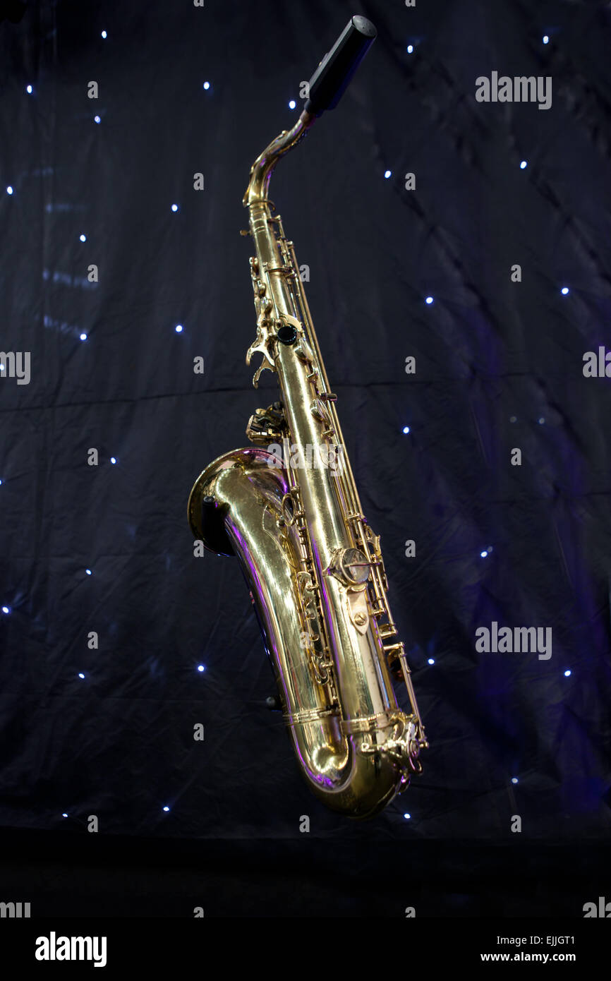 Isolated saxophone over black background with little led lights points shininhg as stars Stock Photo