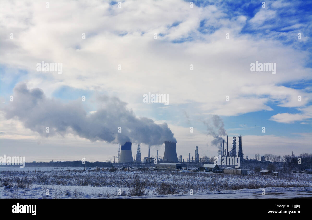 Pollution smoke clouds from energy plant. Stock Photo