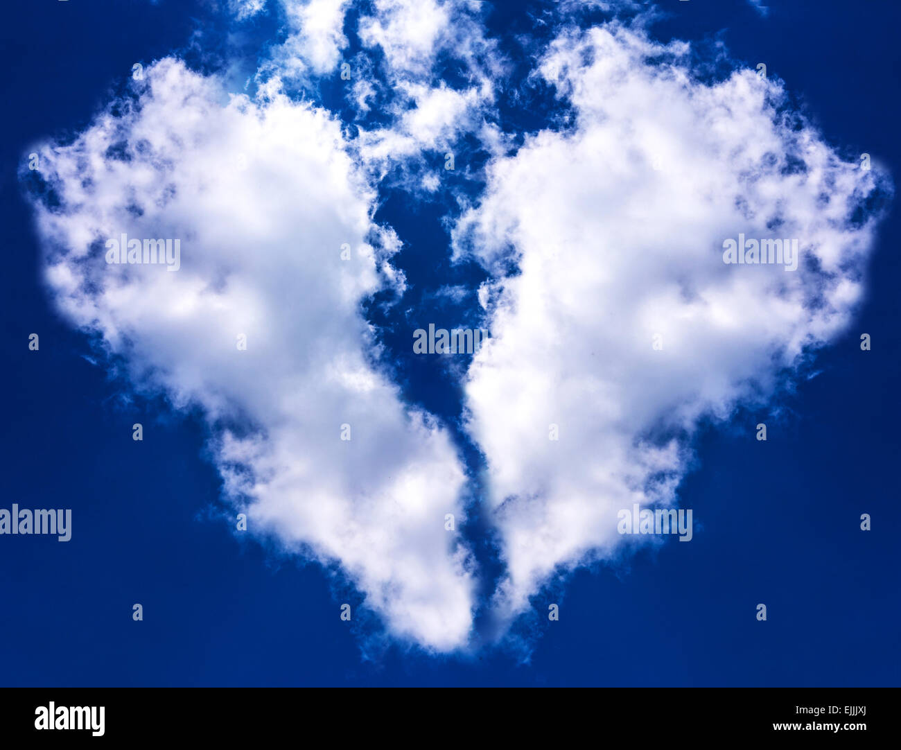 White smoke cloud with broken heart shape. Stock Photo