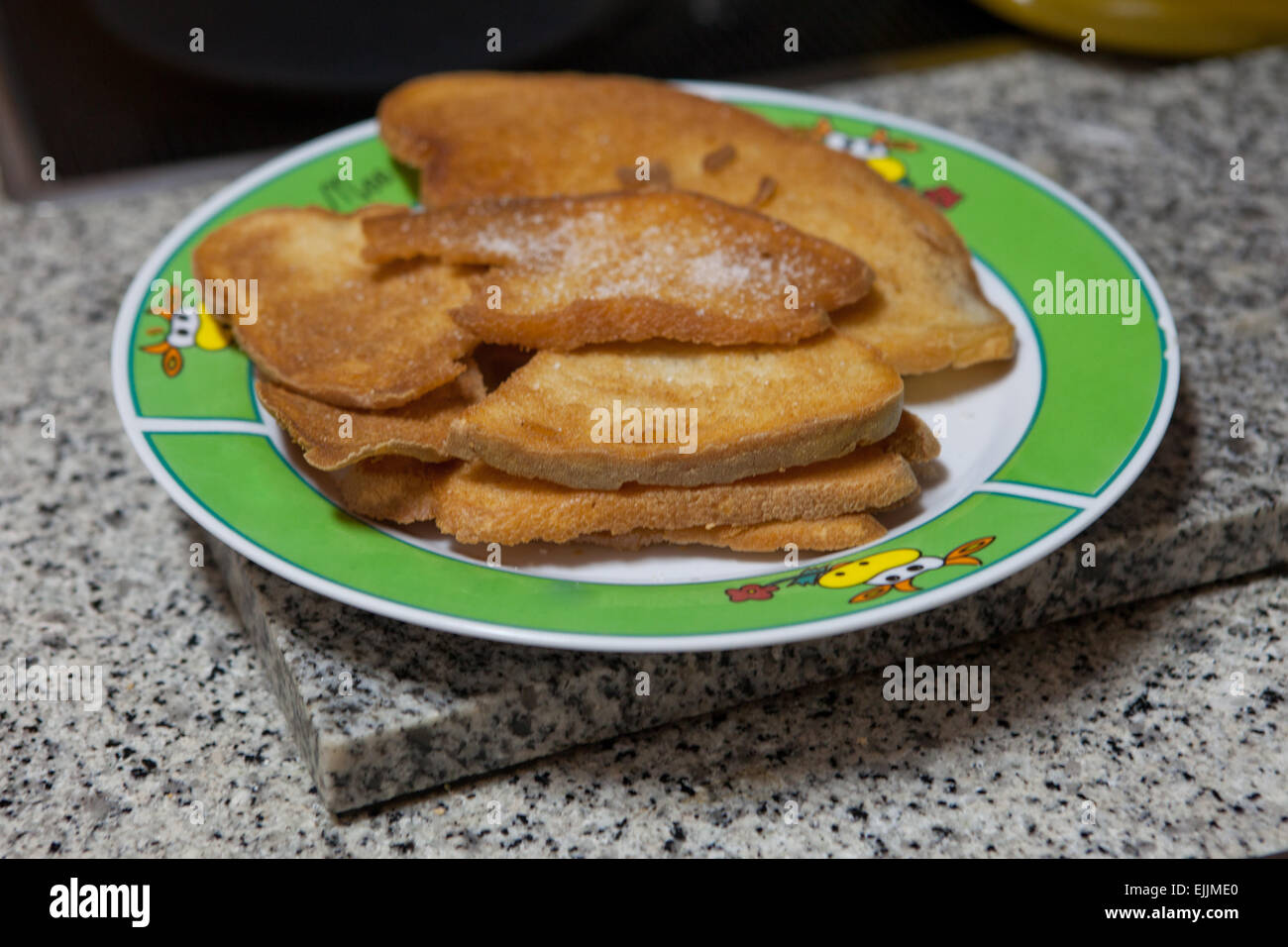 Preparation of fried bread slices, and spanish typical meal for breakfast, also called pringas