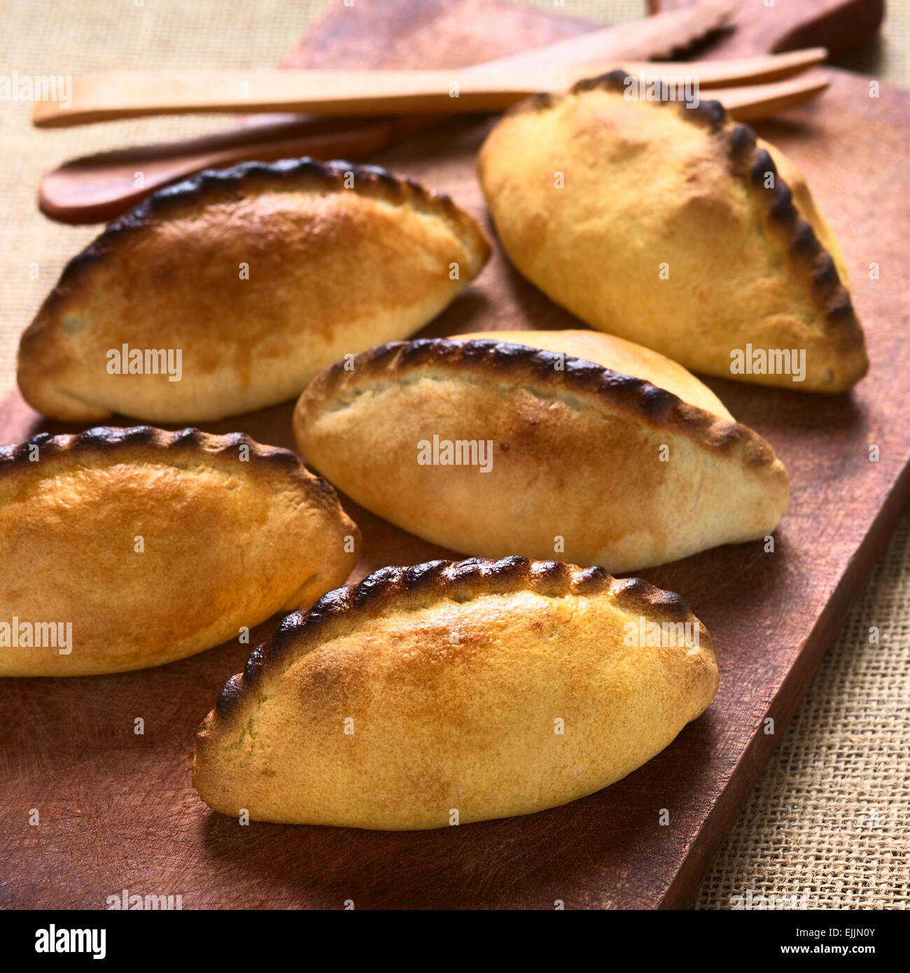 Traditional Bolivian savory pastries called Saltena filled with thick meat stew, which is a very popular street snack in Bolivia Stock Photo