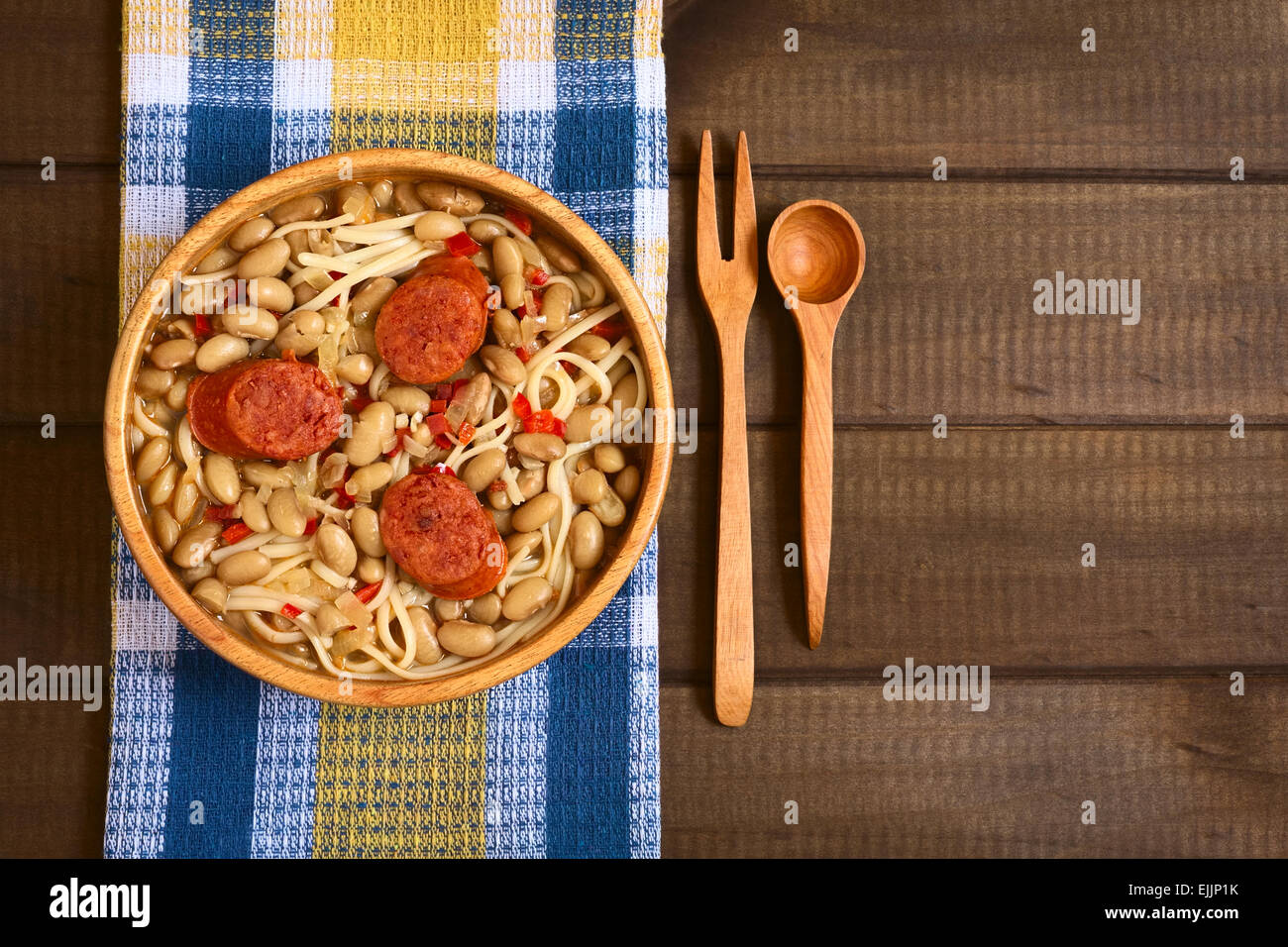 Overhead shot of traditional Chilean dish called Porotos con Riendas (English: beans with reins), made of cooked beans, linguine Stock Photo