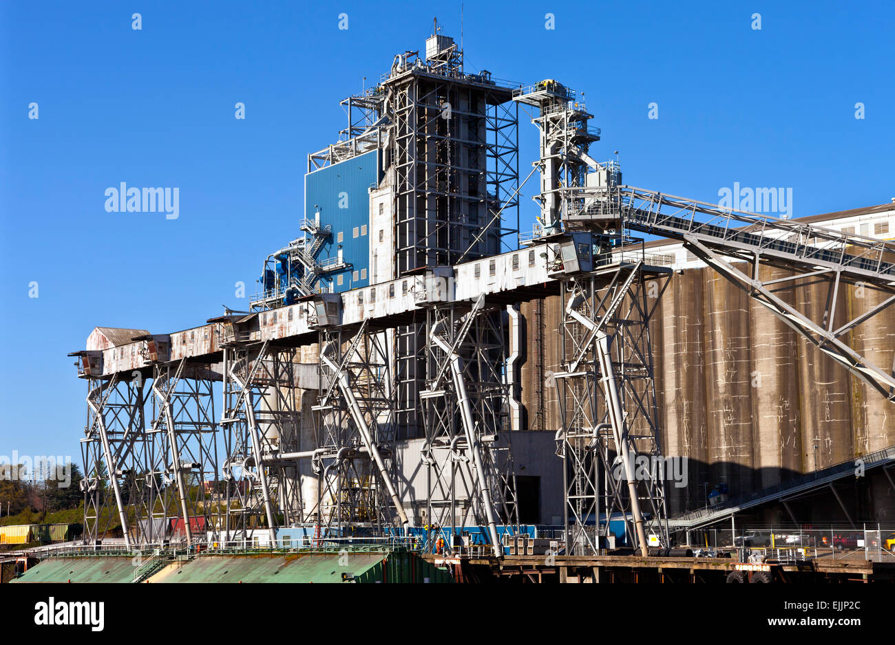 Grain elevators barge and tower Portland Oregon. Stock Photo