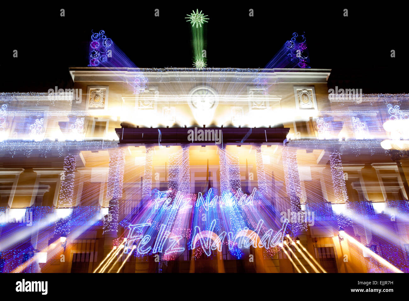 Christmas led light decoration of Badajoz Town Hall at night, Spain. Motion zoomed shot Stock Photo