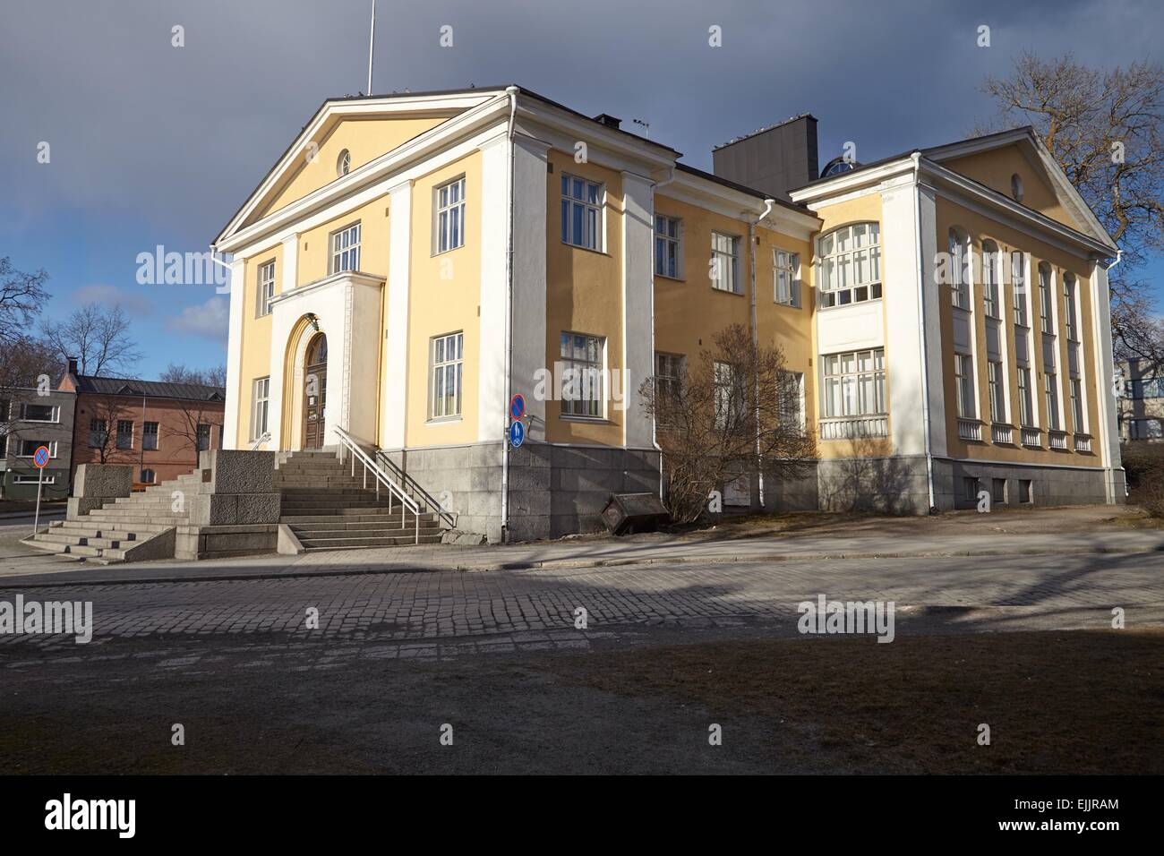 Old library of Hameenlinna in Finland. Early spring sun shining straight to the walls of the building. Stock Photo