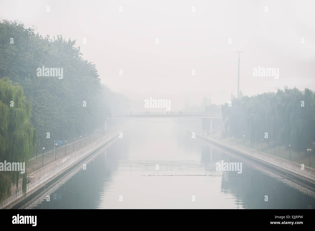 Beijing air pollution seen from a bridge overlooking a canal Stock Photo
