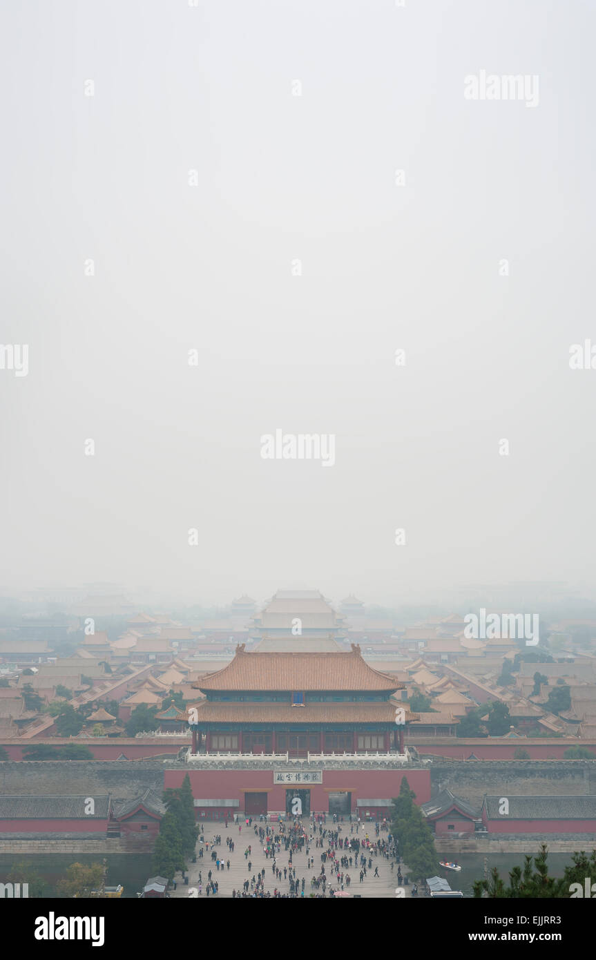 View of the Forbidden City through the air pollution, Beijing. Taken from the top of the hill in Jingshan Park. Stock Photo