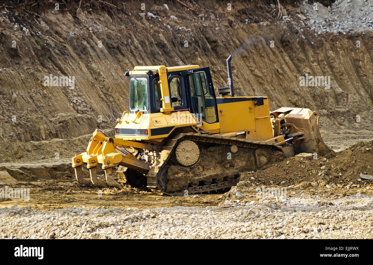 Bulldozer is working at the road construction Stock Photo