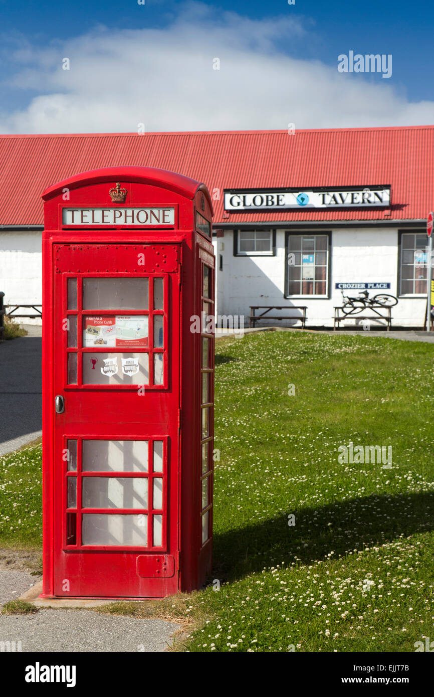 South Atlantic, Falklands, Port Stanley, Philomel Street, Globe Tavern British K6 phone box with unusual door Stock Photo
