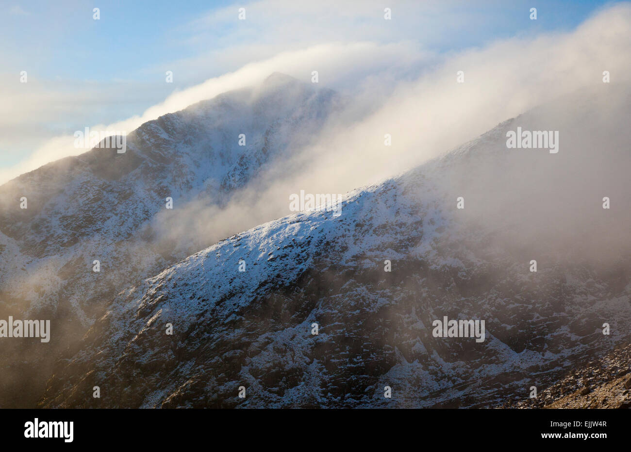 Winter cloud along the ridges of Brandon Peak, Dingle Peninsula, County Kerry, Ireland. Stock Photo