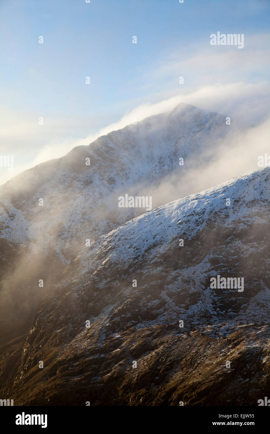 Winter cloud along the ridges of Brandon Peak, Dingle Peninsula, County Kerry, Ireland. Stock Photo