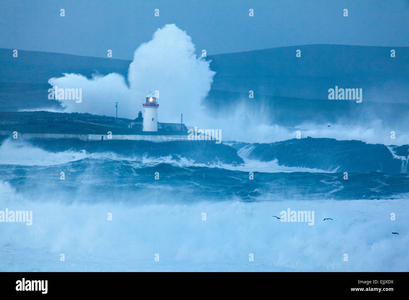 Storm waves breaking over Ballyglass Lighthouse, Broadhaven Bay, County Mayo, Connacht, Ireland. Stock Photo