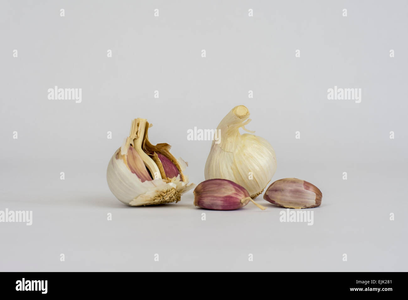 Garlic and cloves on white background Stock Photo - Alamy