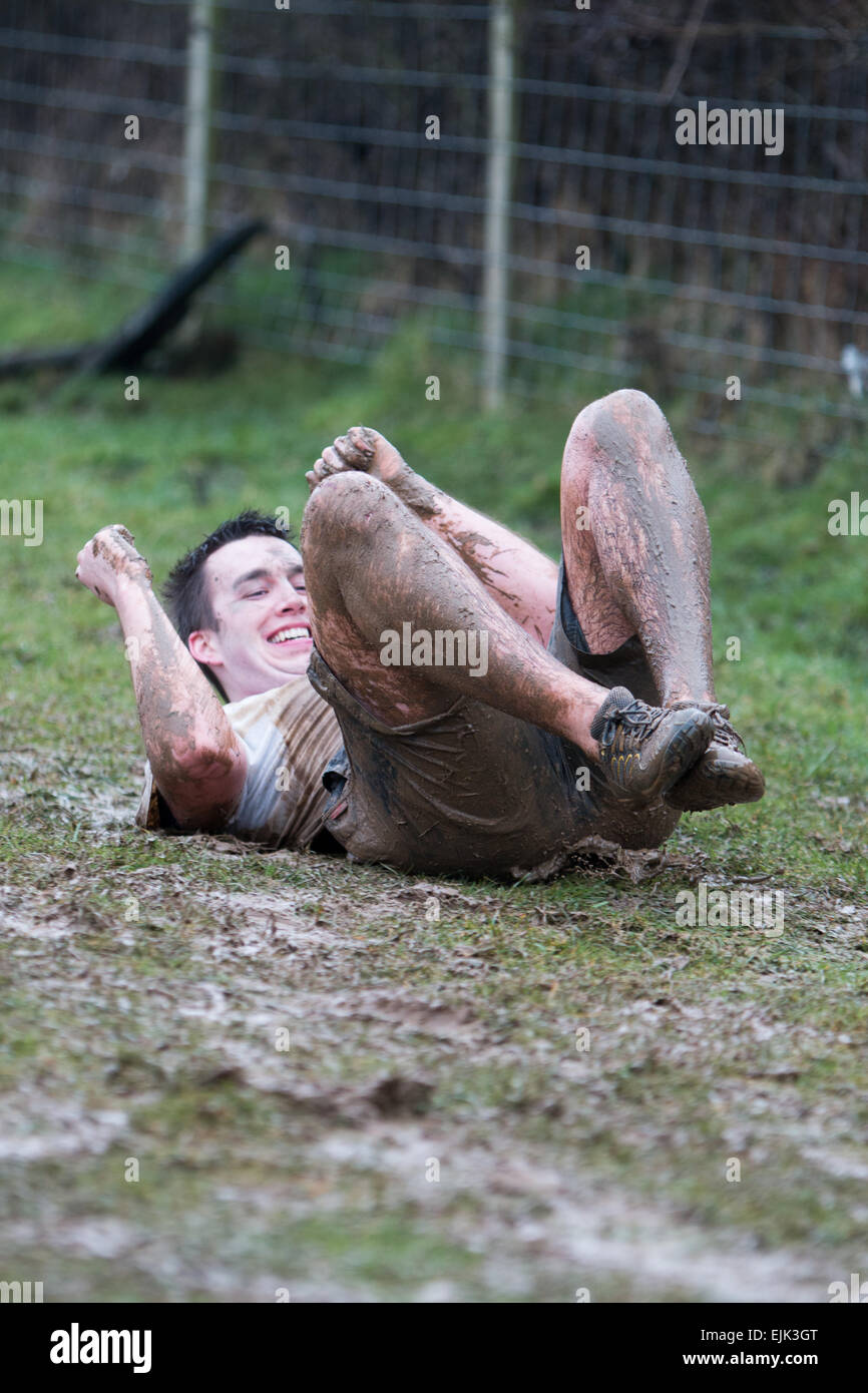 Aberystwyth, Wales, UK. 28th Mar, 2015.  Competitors in the Mud Mountain race make the most of the weather as heavy rain makes the course even tougher. Credit: Jon Freeman/Alamy Live News Stock Photo