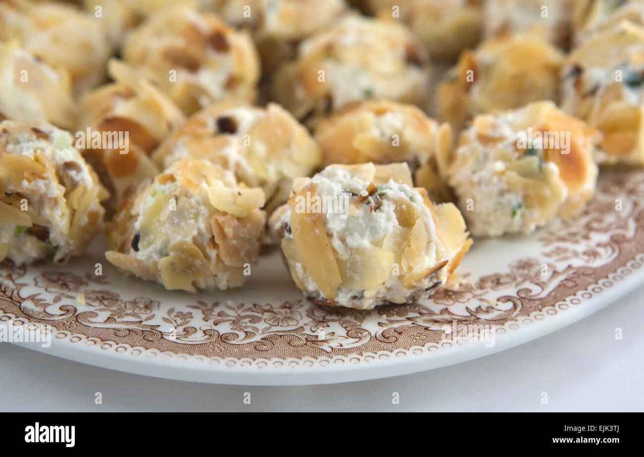 Spread cheese balls with sliced roasted almonds Stock Photo