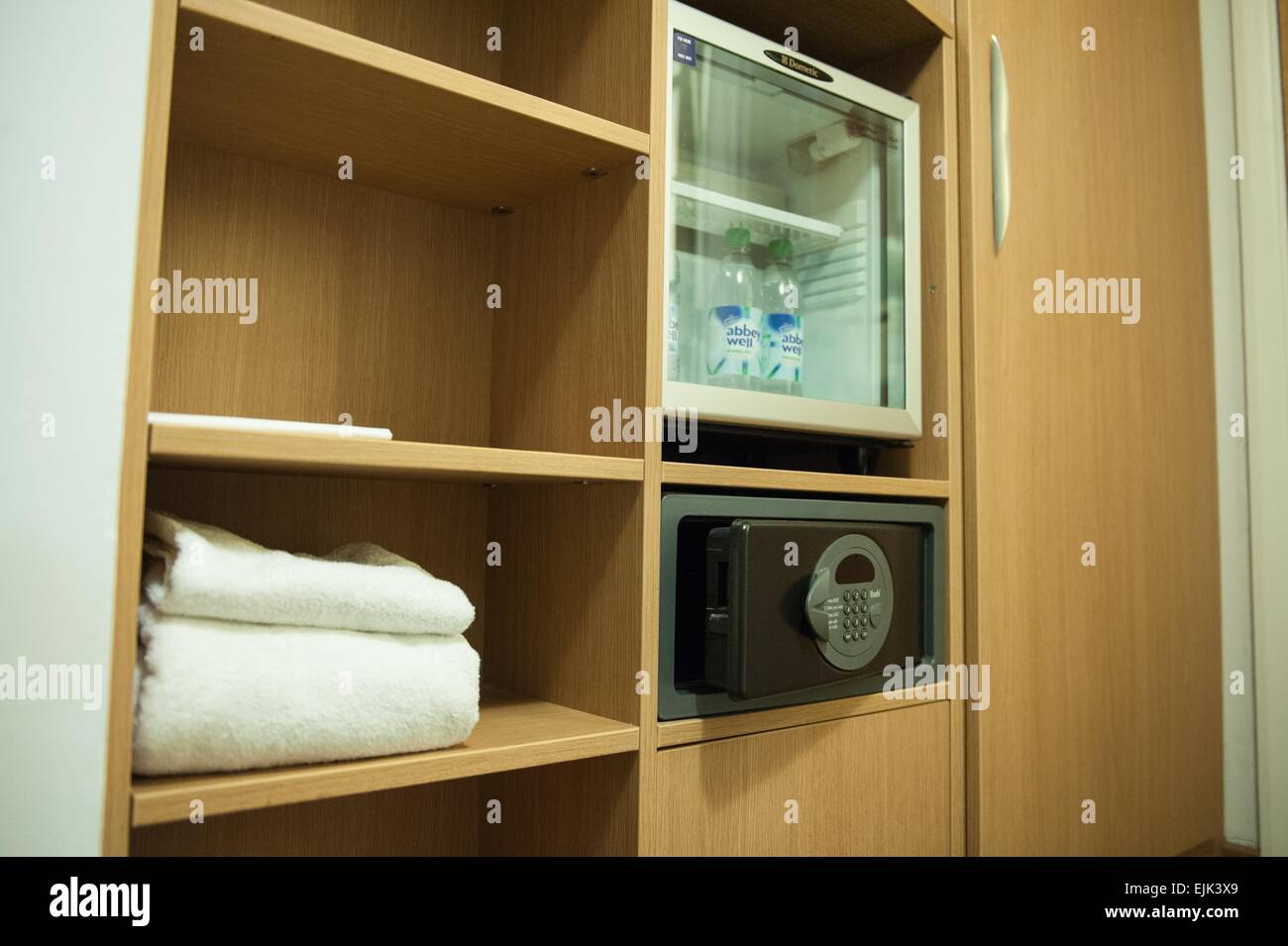 Novotel hotel room mini bar fridge and safe Stock Photo