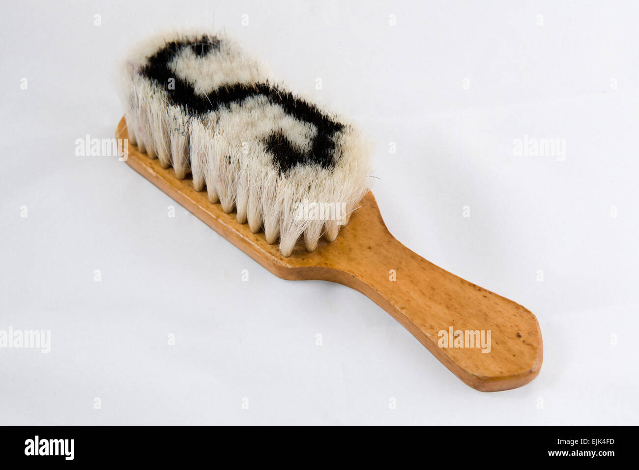 Wooden brush for clothes made of horse tail Stock Photo