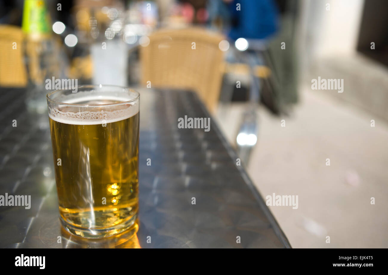 A cold glass of beer during a sunny morning sunday of winter in Cordoba, Spain Stock Photo