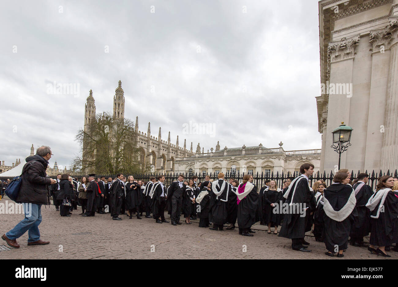 Graduates wait outside King's College Cambridge before receiving the awards. Stock Photo