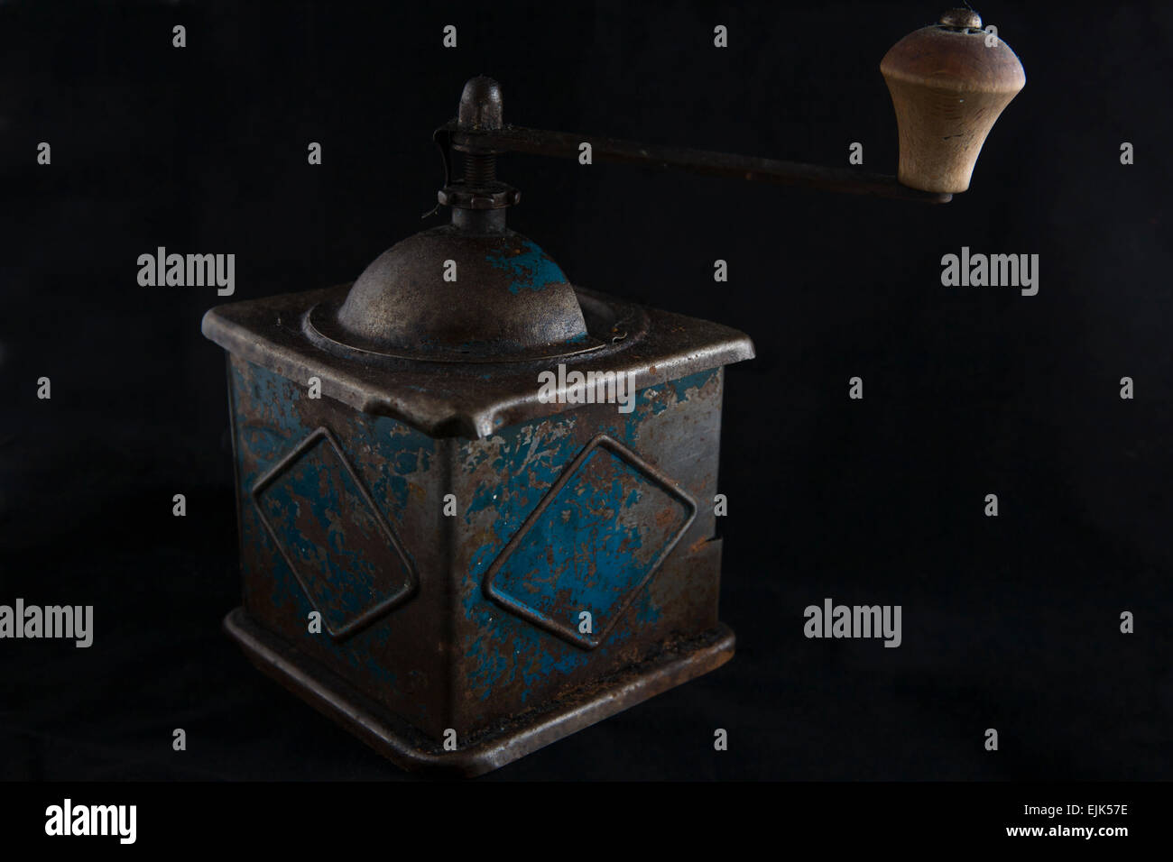 Old manual coffee grinder isolated over black background Stock Photo