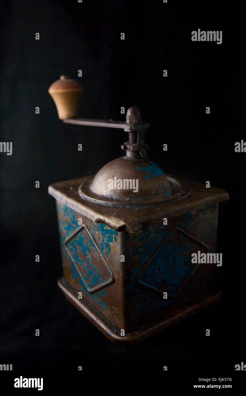 Old manual coffee grinder isolated over black background Stock Photo