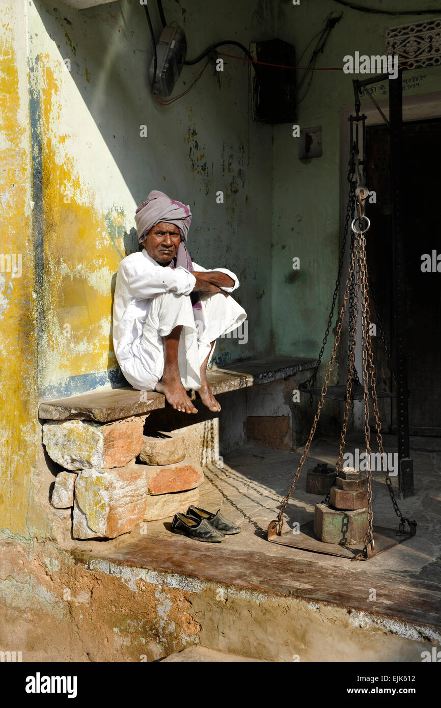 Man with Weighing Scales in Samode, near Jaipur, Rajasthan, India Stock Photo