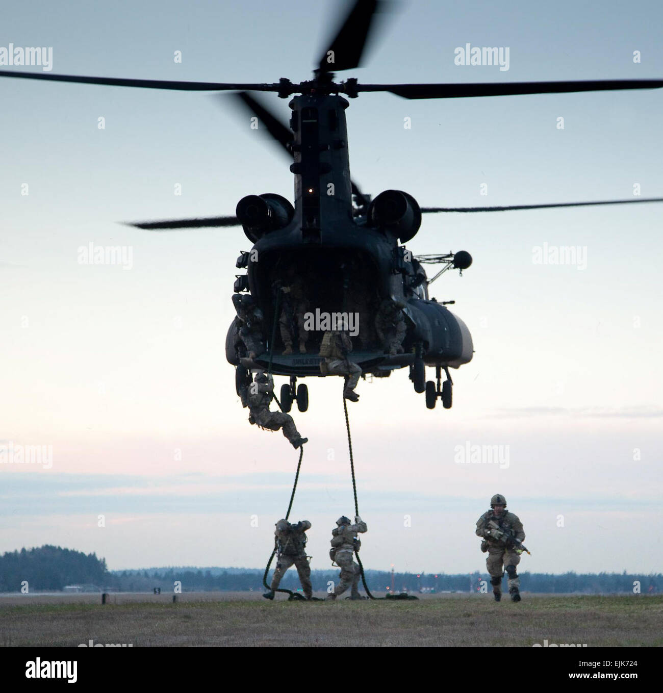 Rangers from B Company, 2nd Battalion, 75th Ranger Regiment, practice Fast Rope Insertion and Extraction FRIES out of an MH-47 from the 160th Special Operations Aviation Regiment during 2nd Battalion’s Task Force Training at Joint Base Lewis-McCord, Wash., March 27, 2013.  Pfc. Connor Mendez Stock Photo