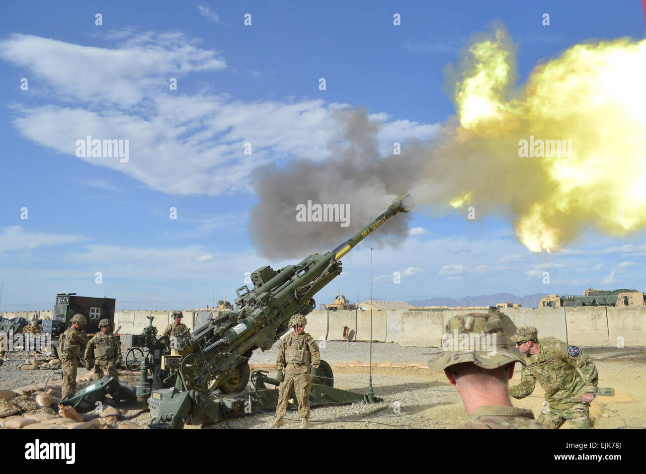 Sgt. Brendan Marrocco's retired brother, Mike Marrocco, fires 155mm howitzer rounds from an M777 with Task Force Blackjack, Bravo battery, 4-25 FA on FOB Shank, Afghanistan. The gentlemen are part of Feherty's Troops First Foundations'  Operation Proper Exit. Operation Proper Exit is for troops that have been injured in battle and provides them the opportunity to make a &quot;proper exit&quot; on their own terms.  Staff Sgt. Nelia Chappell Stock Photo