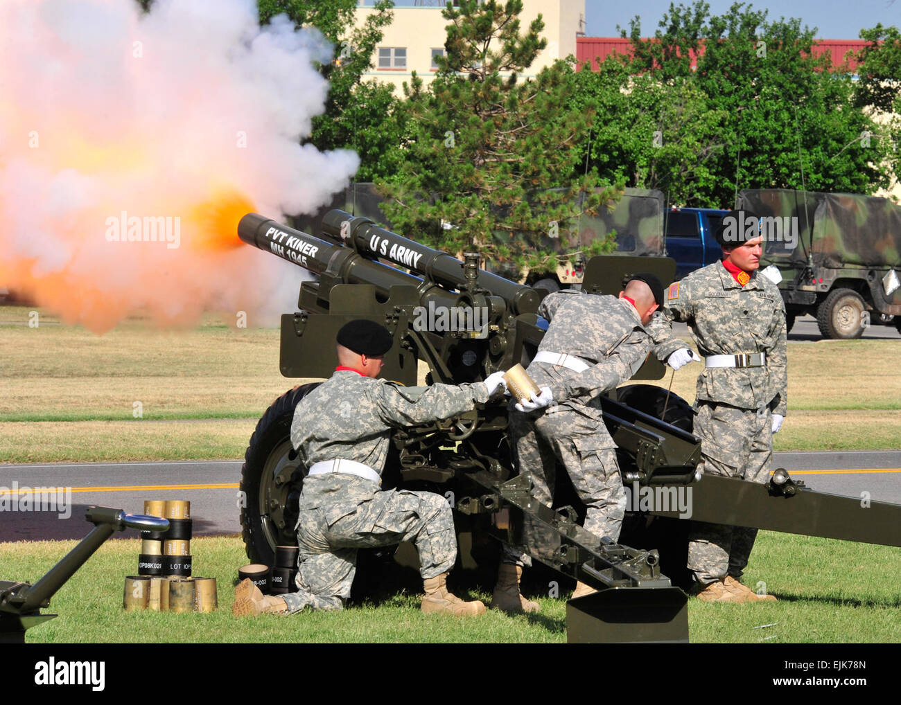 Soldiers from Battery B, 2nd Battalion, 2nd Field Artillery fire a salute to the tune of the