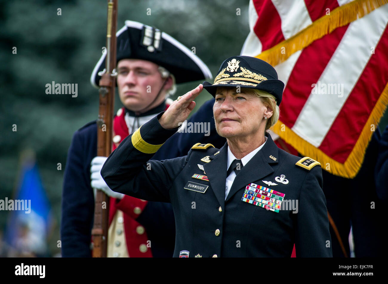 U.S. Army Gen. Ann E. Dunwoody salutes during the playing of the national anthem at her retirement ceremony on Joint Base Myer-Henderson Hall, Va., Aug. 15, 2012. Dunwoody retired after 38 years of service, becoming the first female in the U.S. Military to achieve the rank of 4-Star General.  Staff Sgt. Teddy Wade Stock Photo