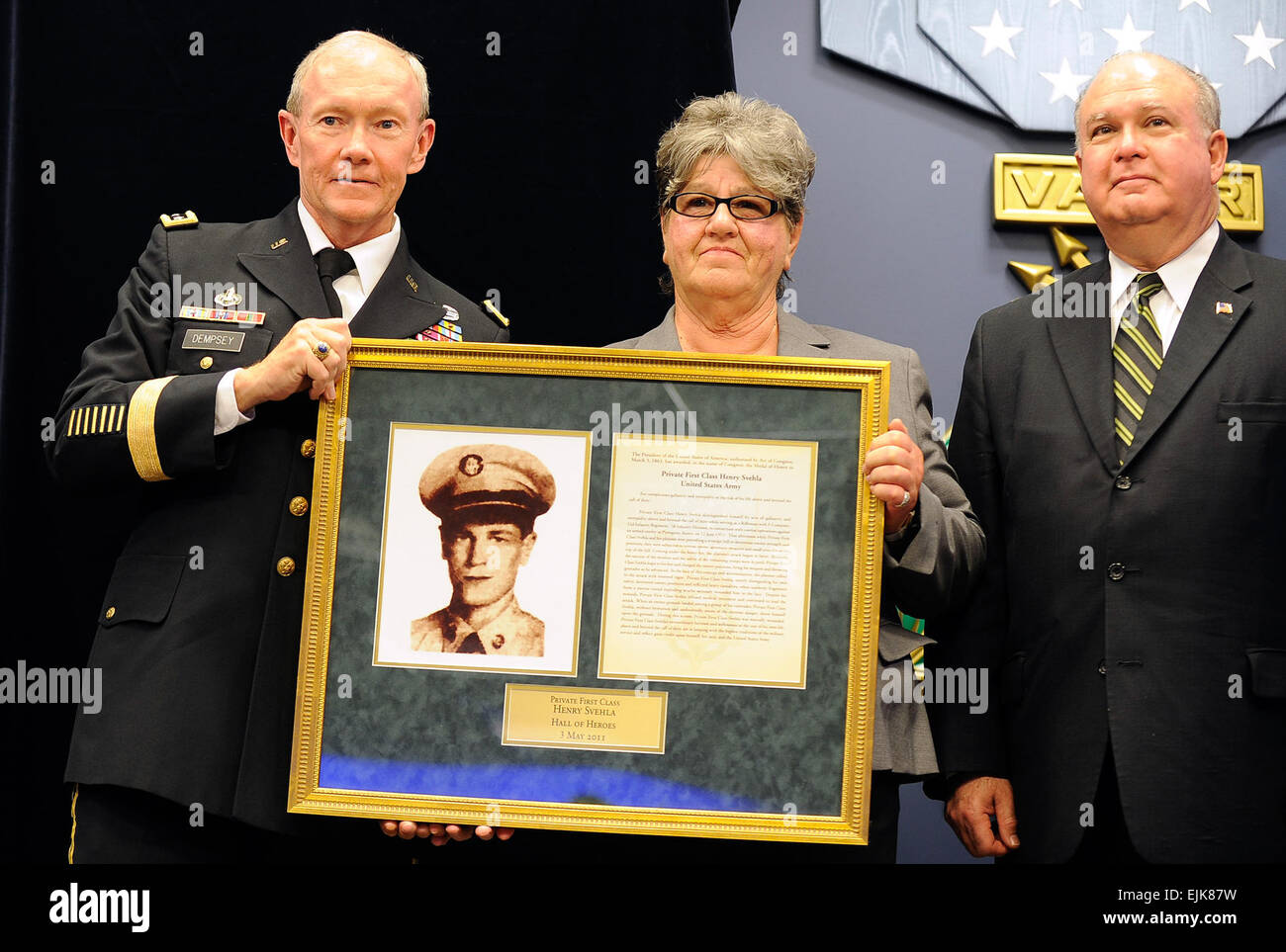 Chief of Staff of the Army Gen. Martin Dempsey presents the Hall of Heroes induction plaque to Silvia Svehla, sister of Korean War Medal of Honor recipient Army Private 1st Class Henry Svehla, during a ceremony at the Pentagon, May 3, 2011.  Defense Department photo by Cherie Cullen  /medalofhonor/?ref=home-spot0-title  /medalofhonor/?ref=home-spot0-title Stock Photo