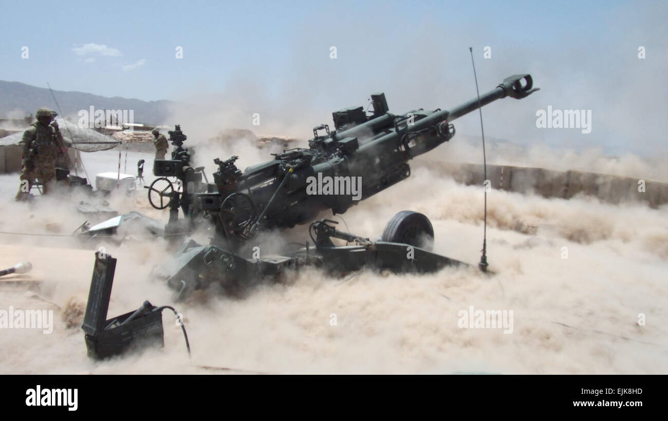 Soldiers from 3rd Howitzer Section, Alpha Battery, 28th Field Artillery fire the M777 at COP